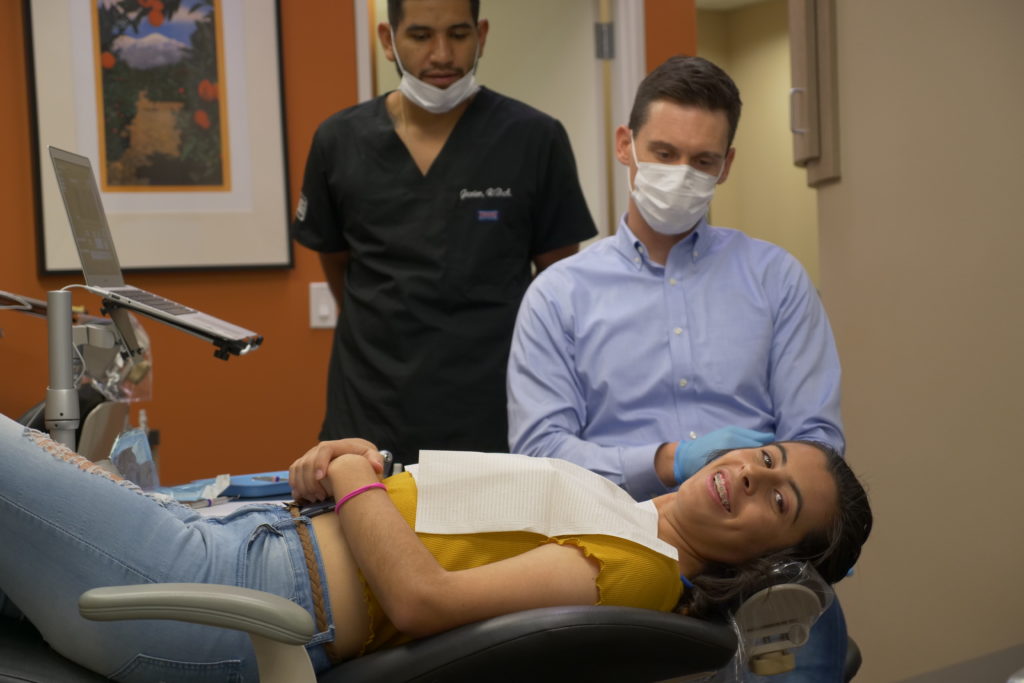 Dr. Lee working with a patient