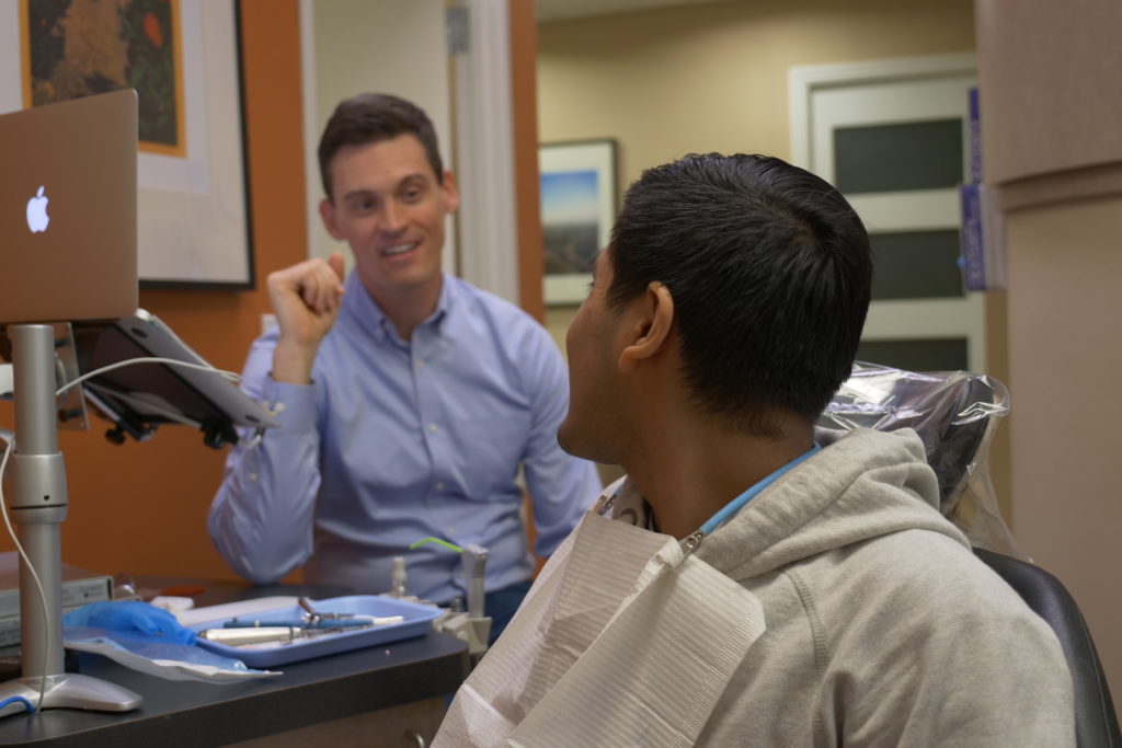 Dr. Jared Lee talking to a patient