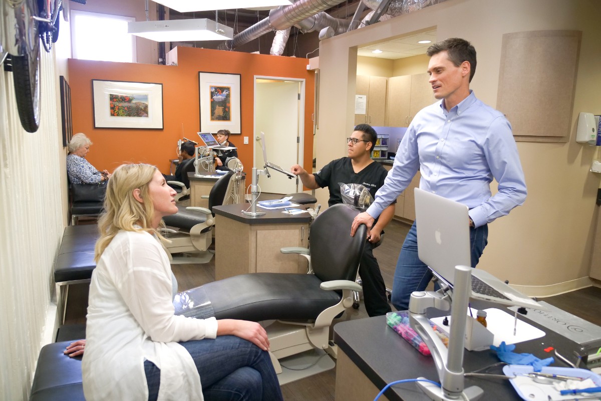 Dr. Lee talking with an adult patient