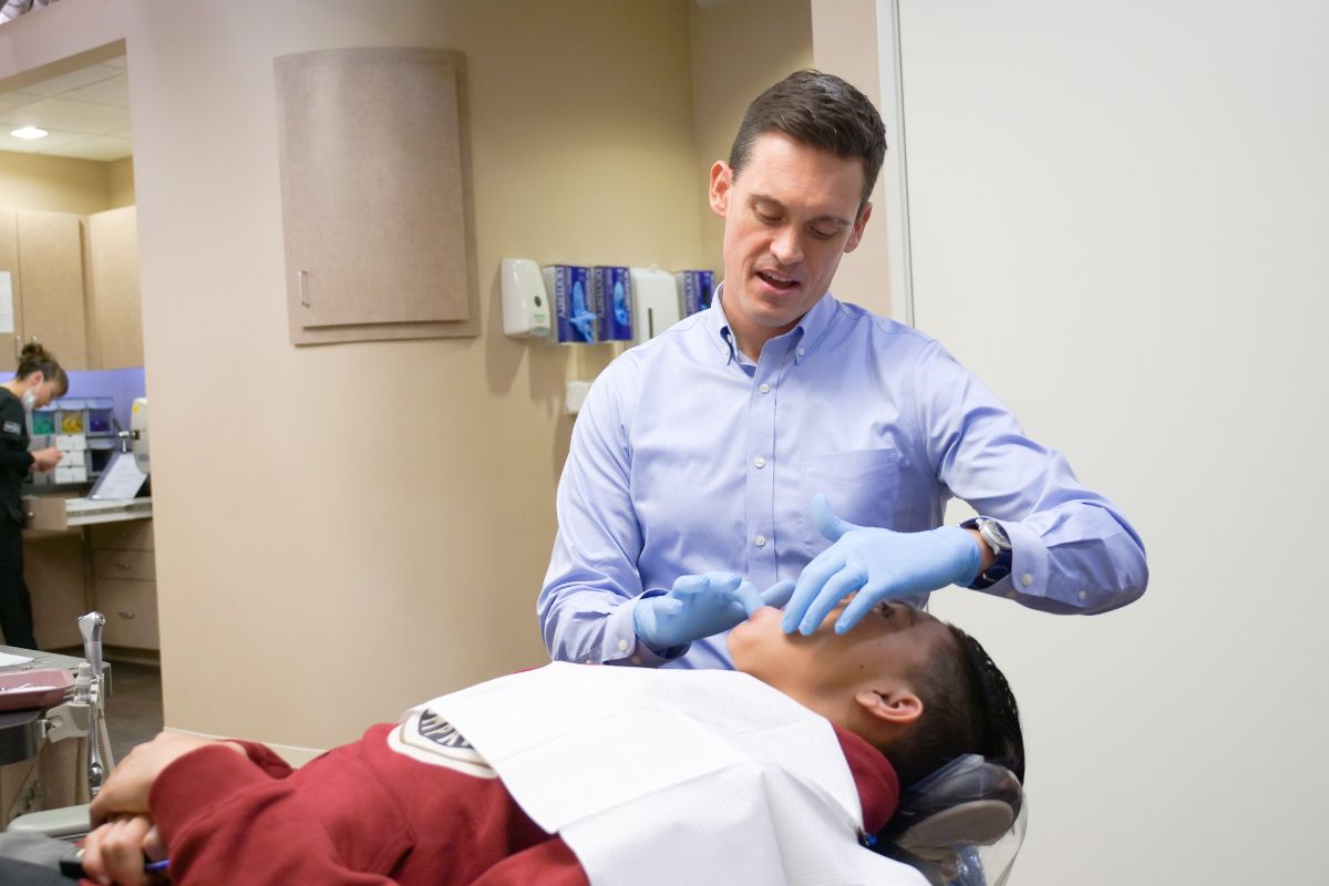 Dr. Lee working on a patient's teeth